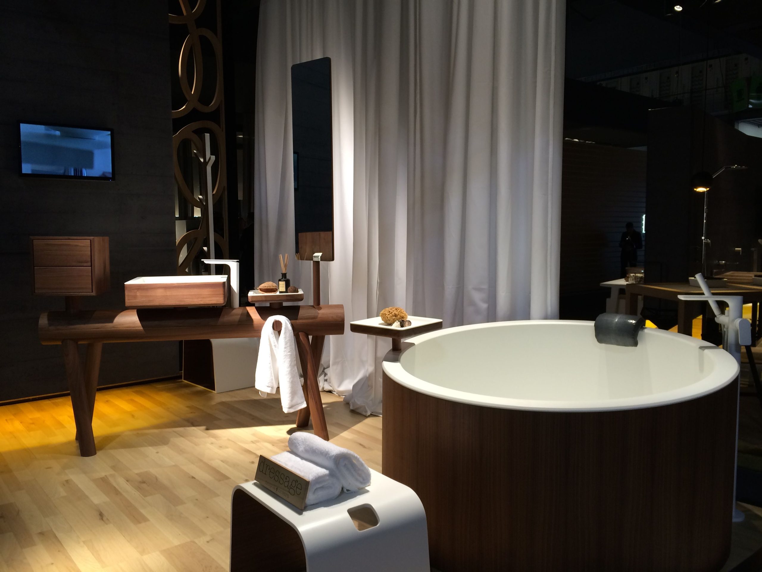 From Graff's Dressage collection, both the wooden tub and the washstand have the warmth solid wood. Their resign uses Corian® solid surface material on the inside.